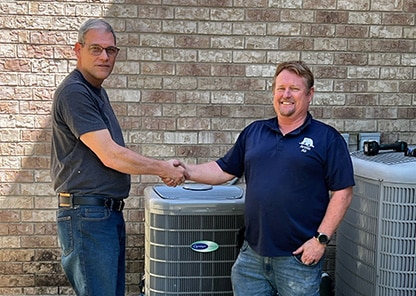 arctic air georgetown hvac tech shaking hands with customer